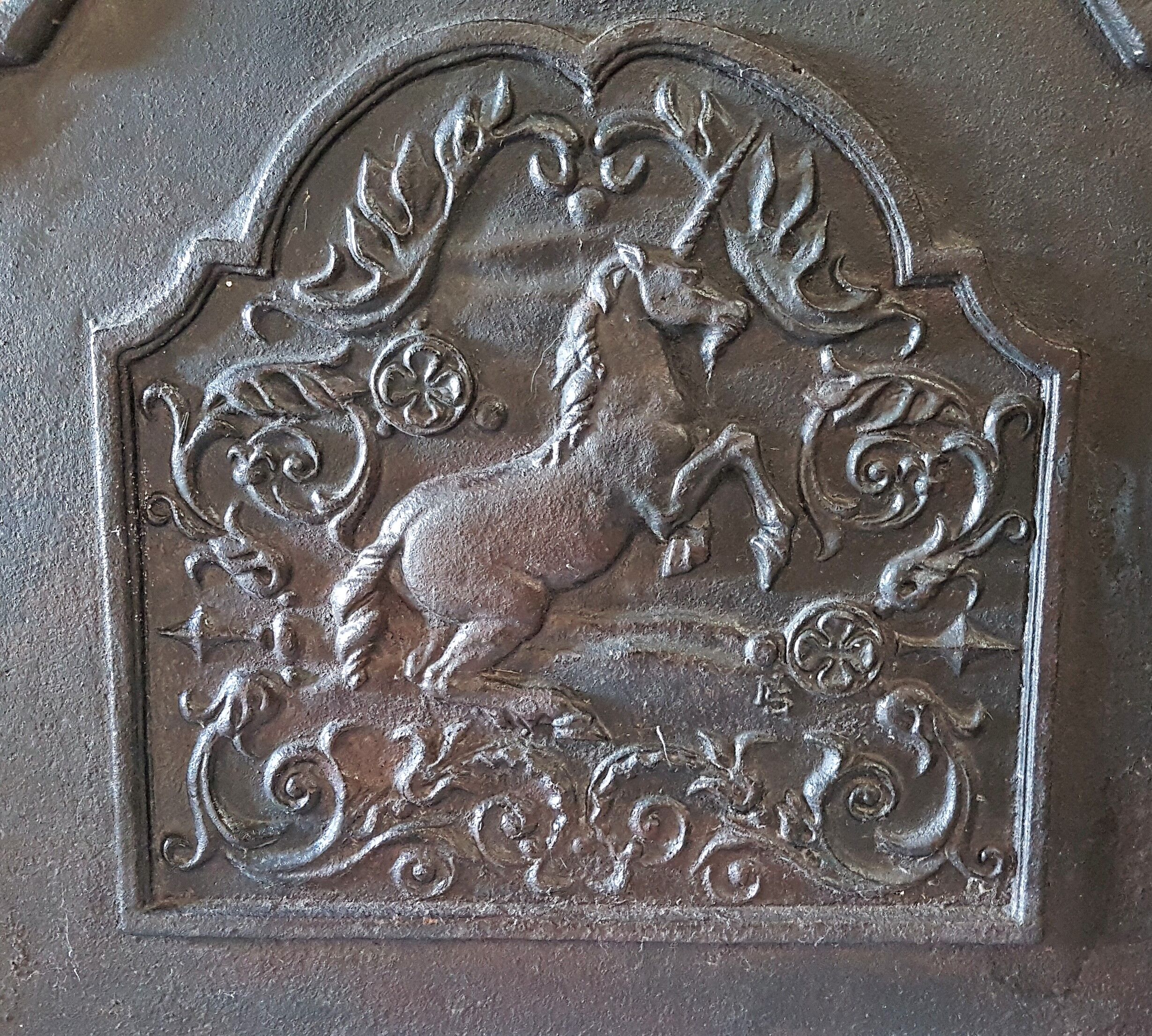 Old cast-glass fireplace plate