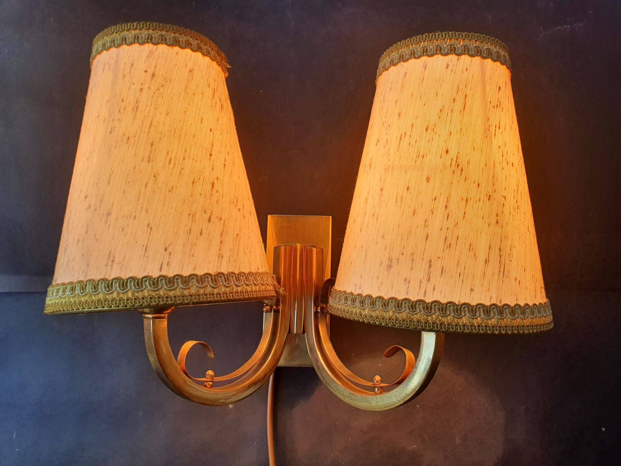 Pair of bronze wall sconces with 1940s Art Deco lampshades.