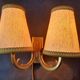 Pair of bronze wall sconces with 1940s Art Deco lampshades.