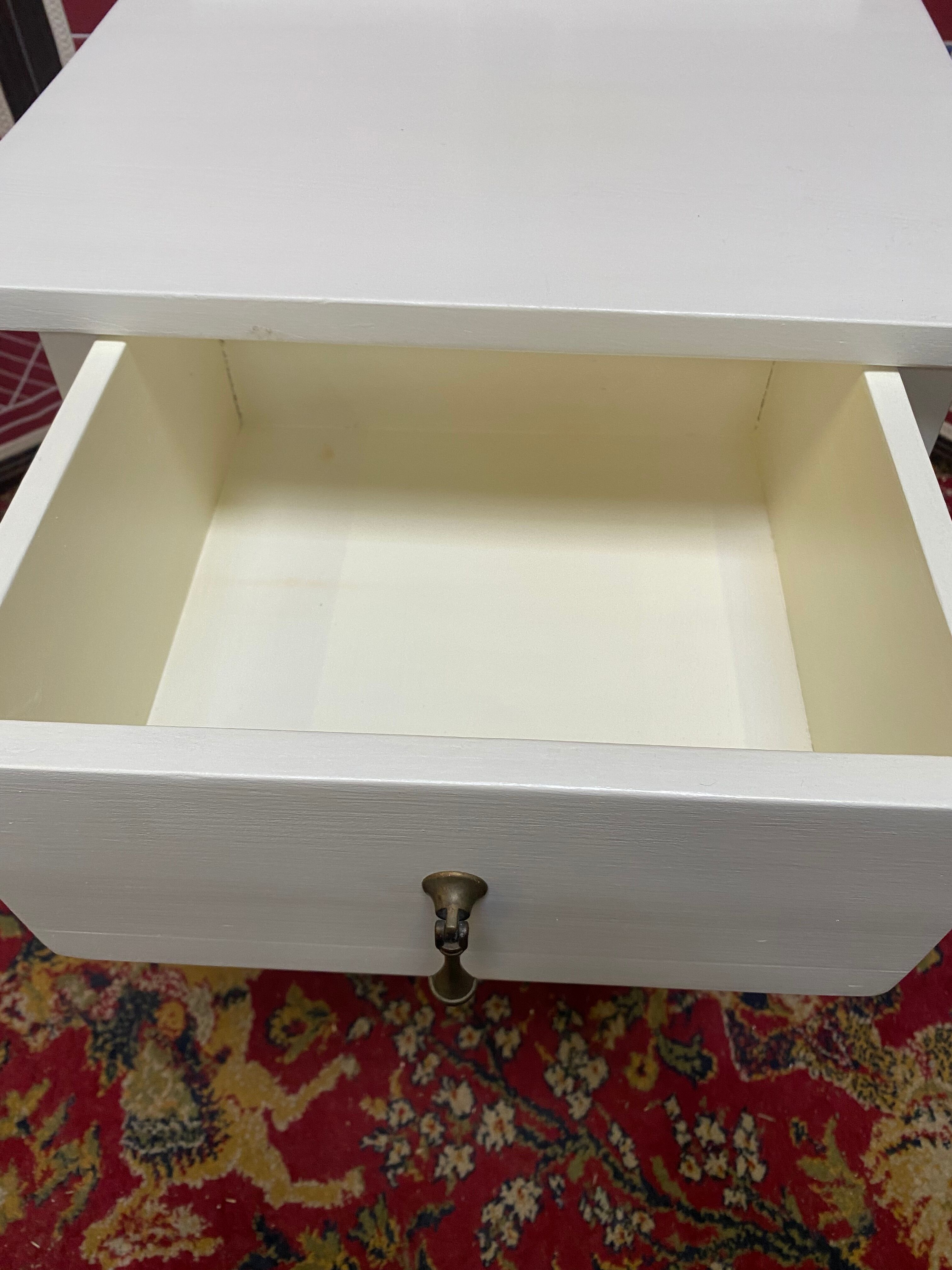 Wooden bedside table painted white