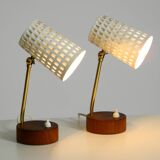 A pair of mid-century modern bedside lamps with perforated metal shades