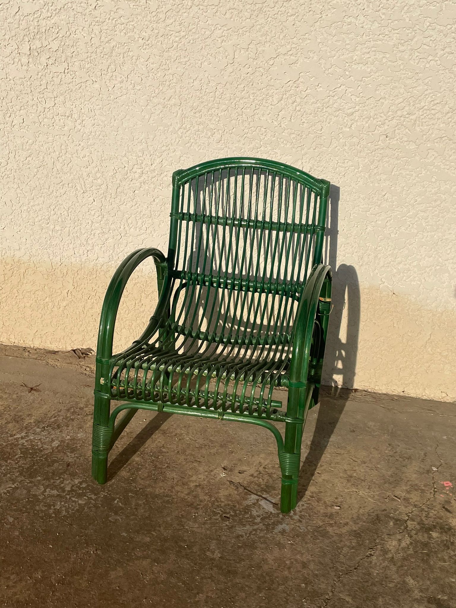 Green rattan armchair