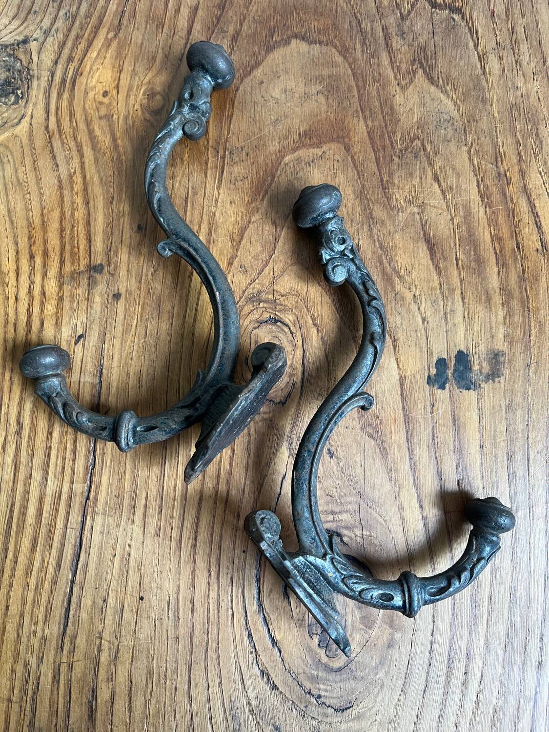 Pair of old cast iron coat hooks
