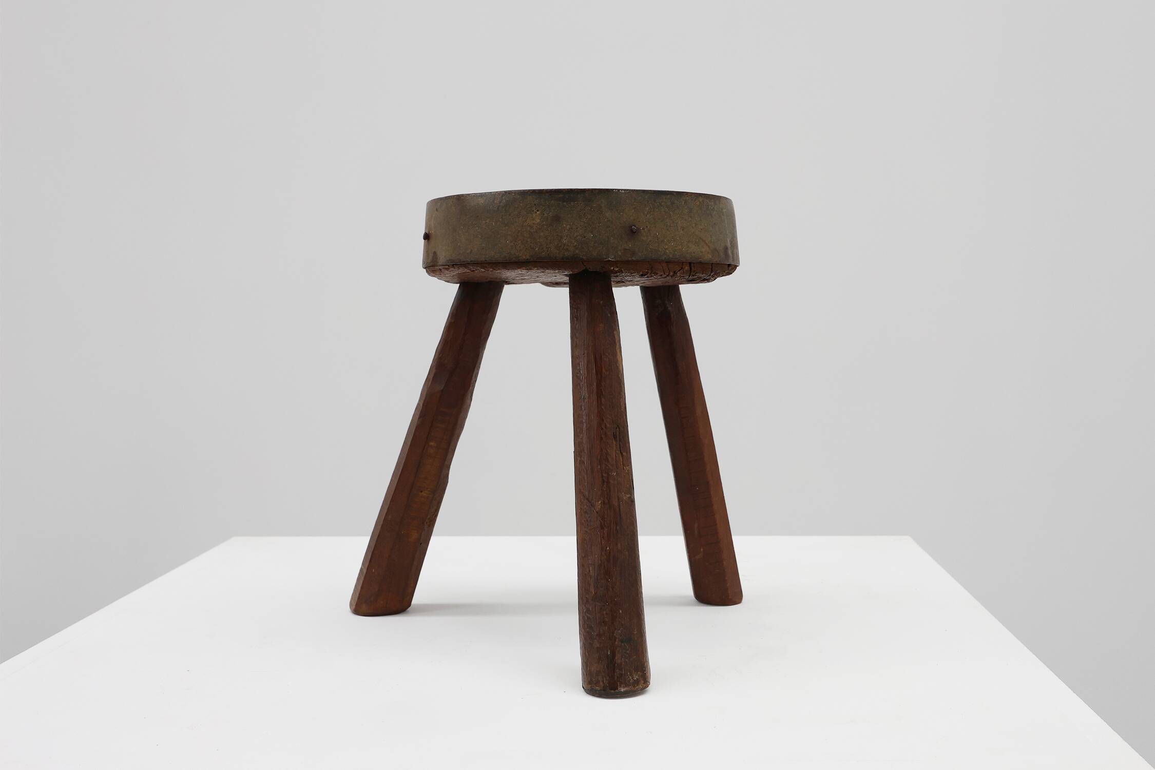 Brutalist French solid oak tripod stool with metal rim, 1850s