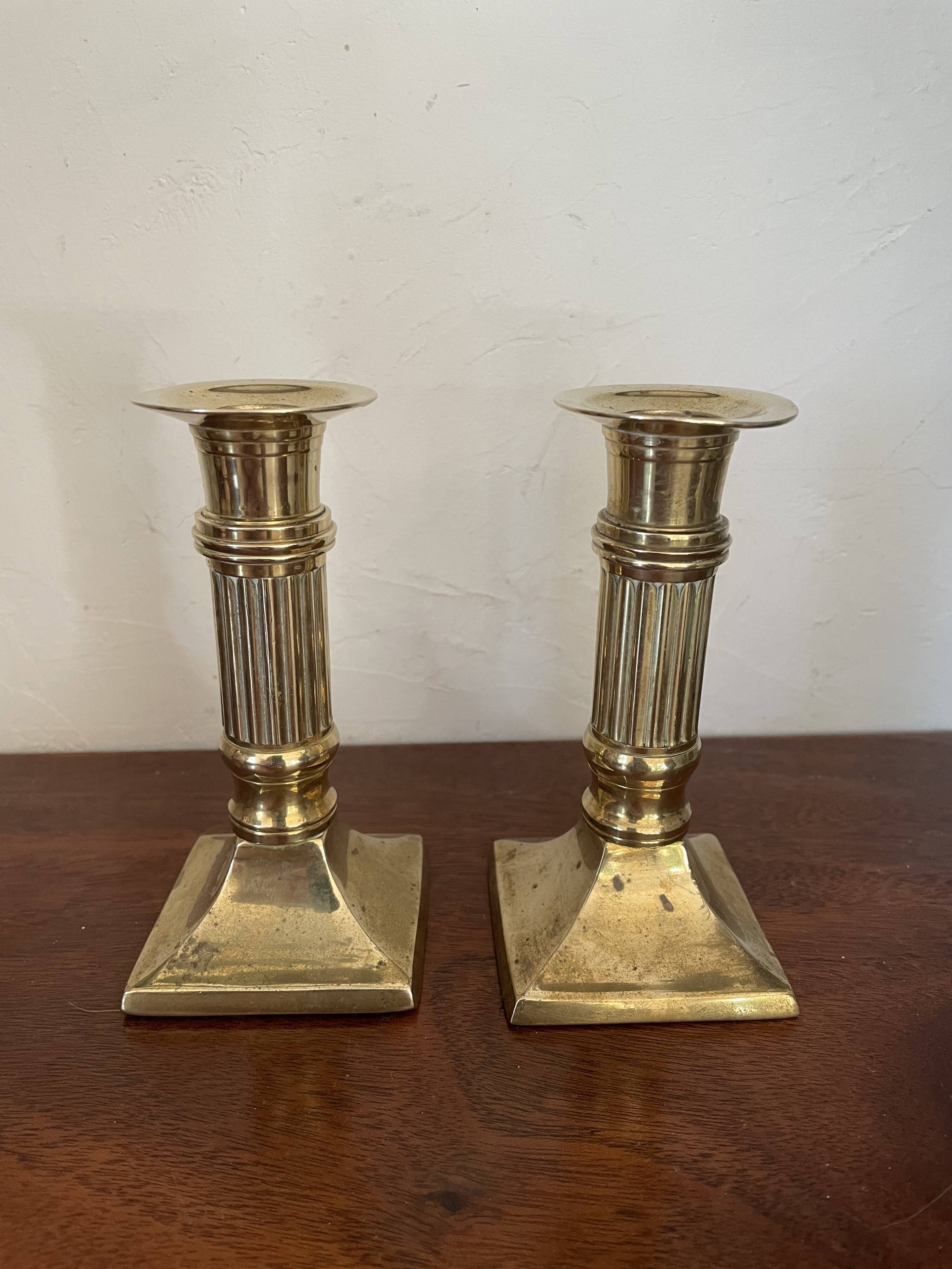 Pair of brass column candle holders