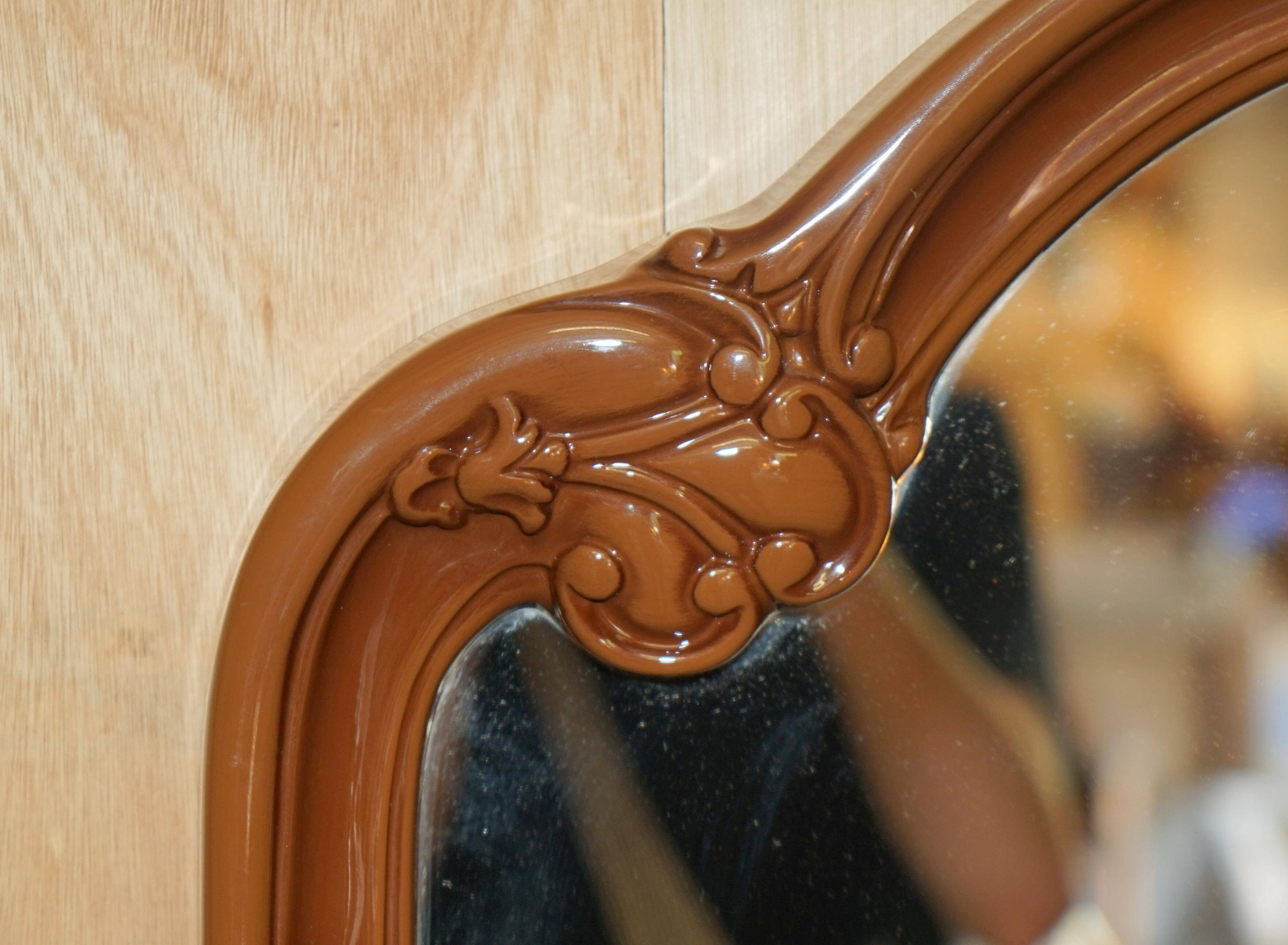 Vintage Art Deco decorative mirror with a thick frame.