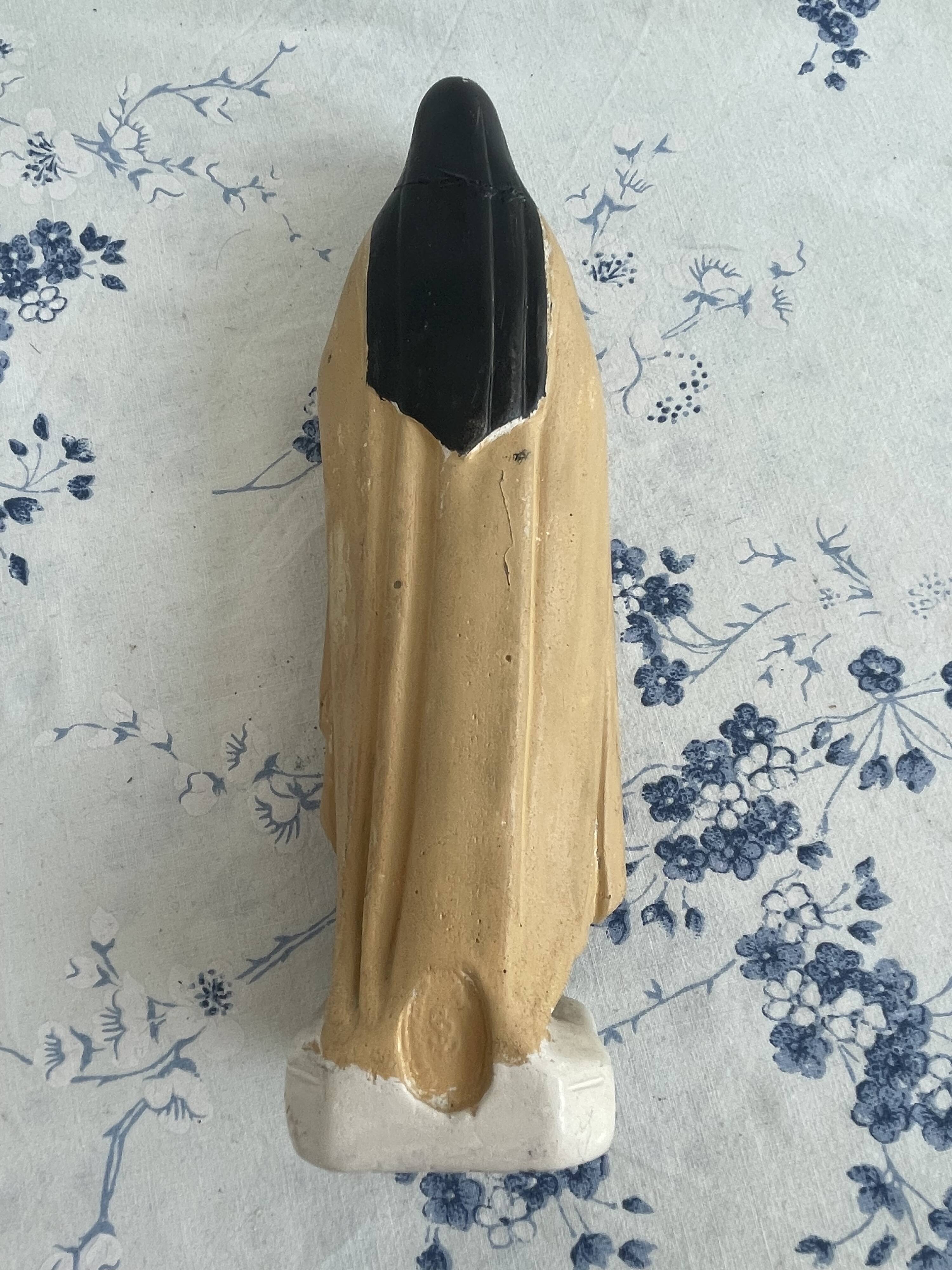 Antique statue of Saint Therese of Lisieux, religious plaster figurine