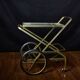 Vintage rolling trolley in gold metal & smoked glass – Retro elegance as