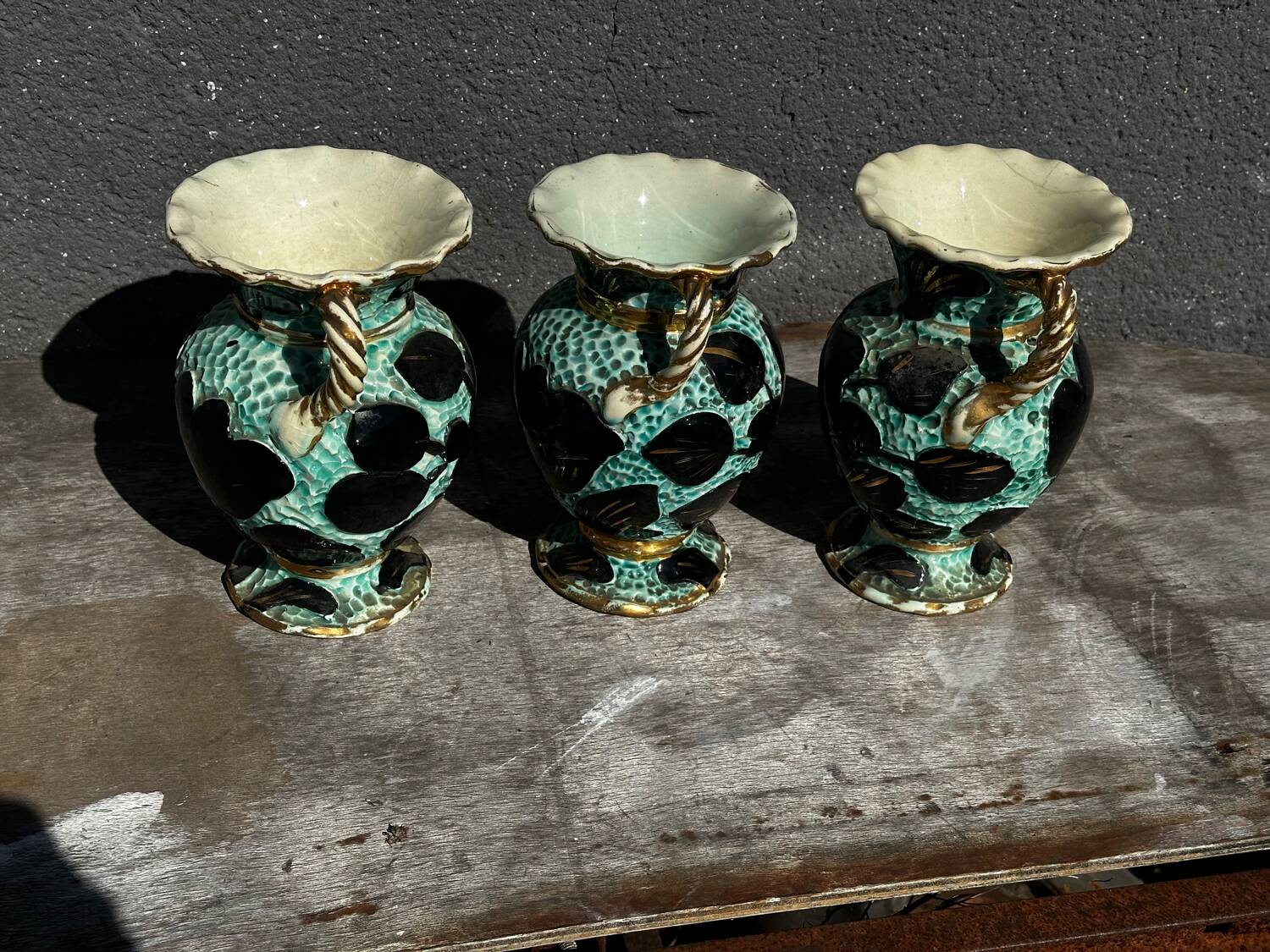 Trio of Vallauris vases in turquoise and black, highlighted with gold, 22 cm high
