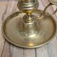 Antique brass candlestick with pusher