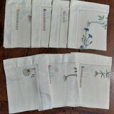 Embroidered placemats in vintage linen field flowers series of seven