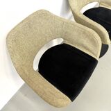 Series of six swivel chairs with an organic shell, patterned fabric and base.
