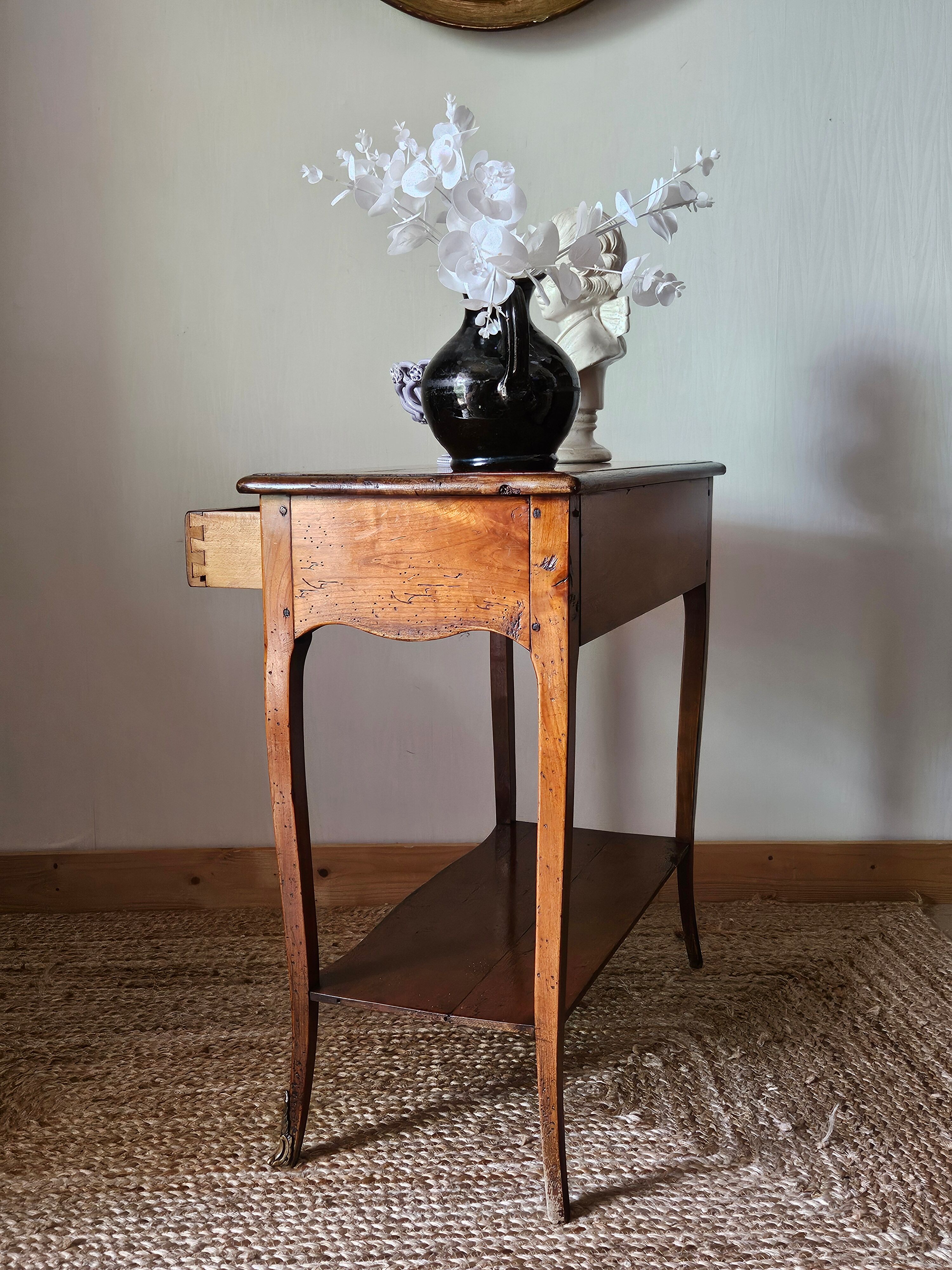 Louis XV style console in cherry wood, 20th century.