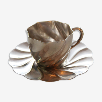 Silver cup with matching saucers