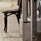 Photo of New York, Cat with rolling eyes in front of a shoe shine, 1960