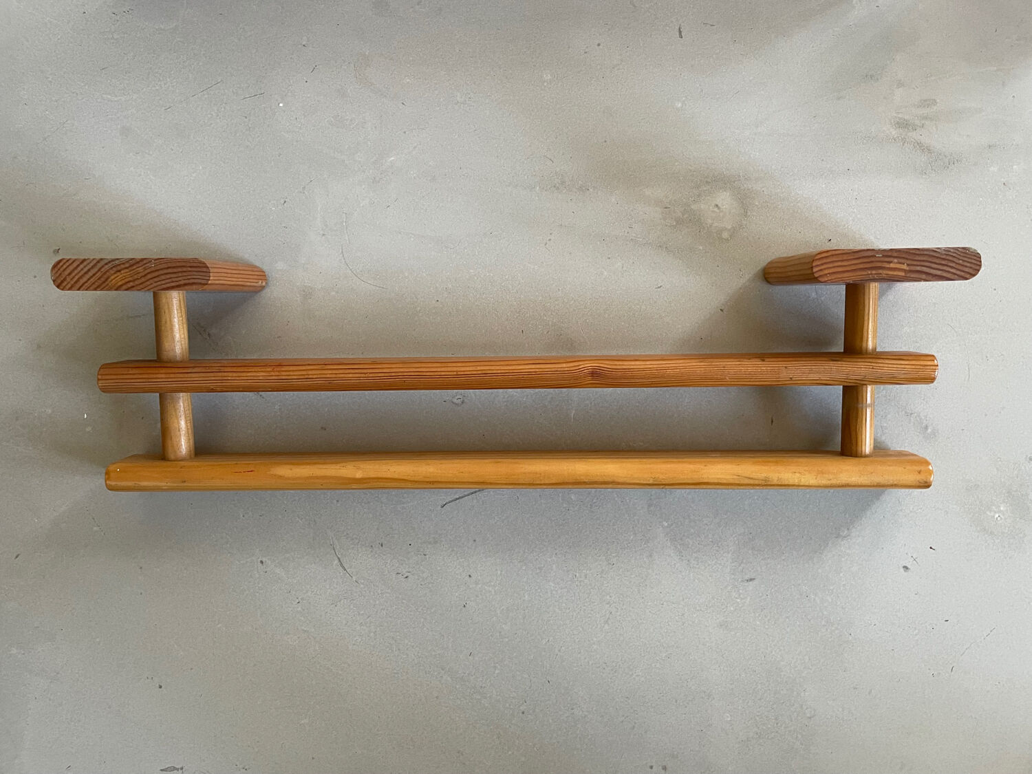 Wooden wall-mounted towel rack