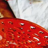 Orange enamelled cast iron oval trivet