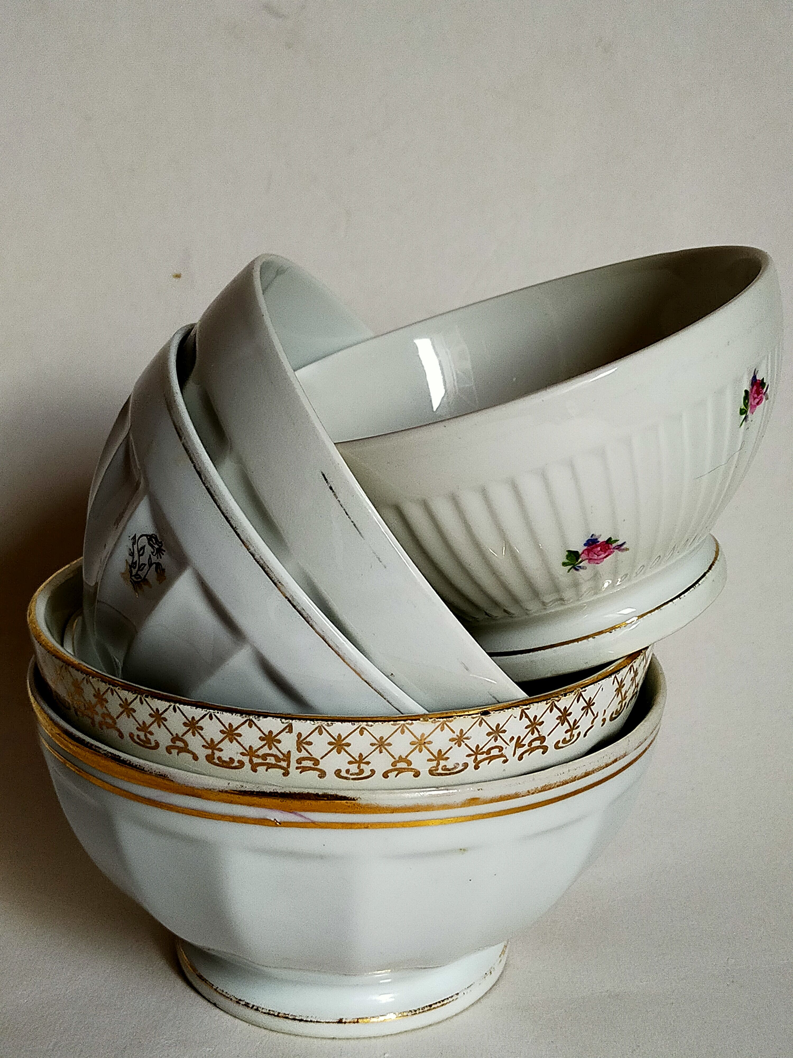 Five matching antique porcelain and earthenware bowls