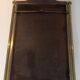 Neoclassical style mirror in brass and lacquered sheet metal.