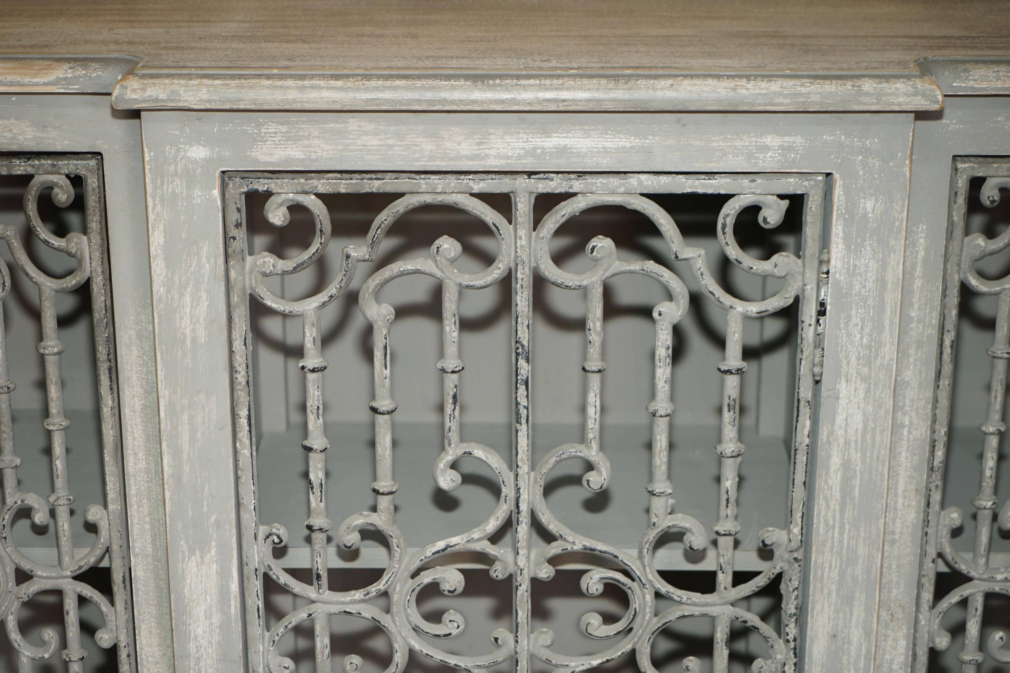 Vintage sideboard with wrought iron doors