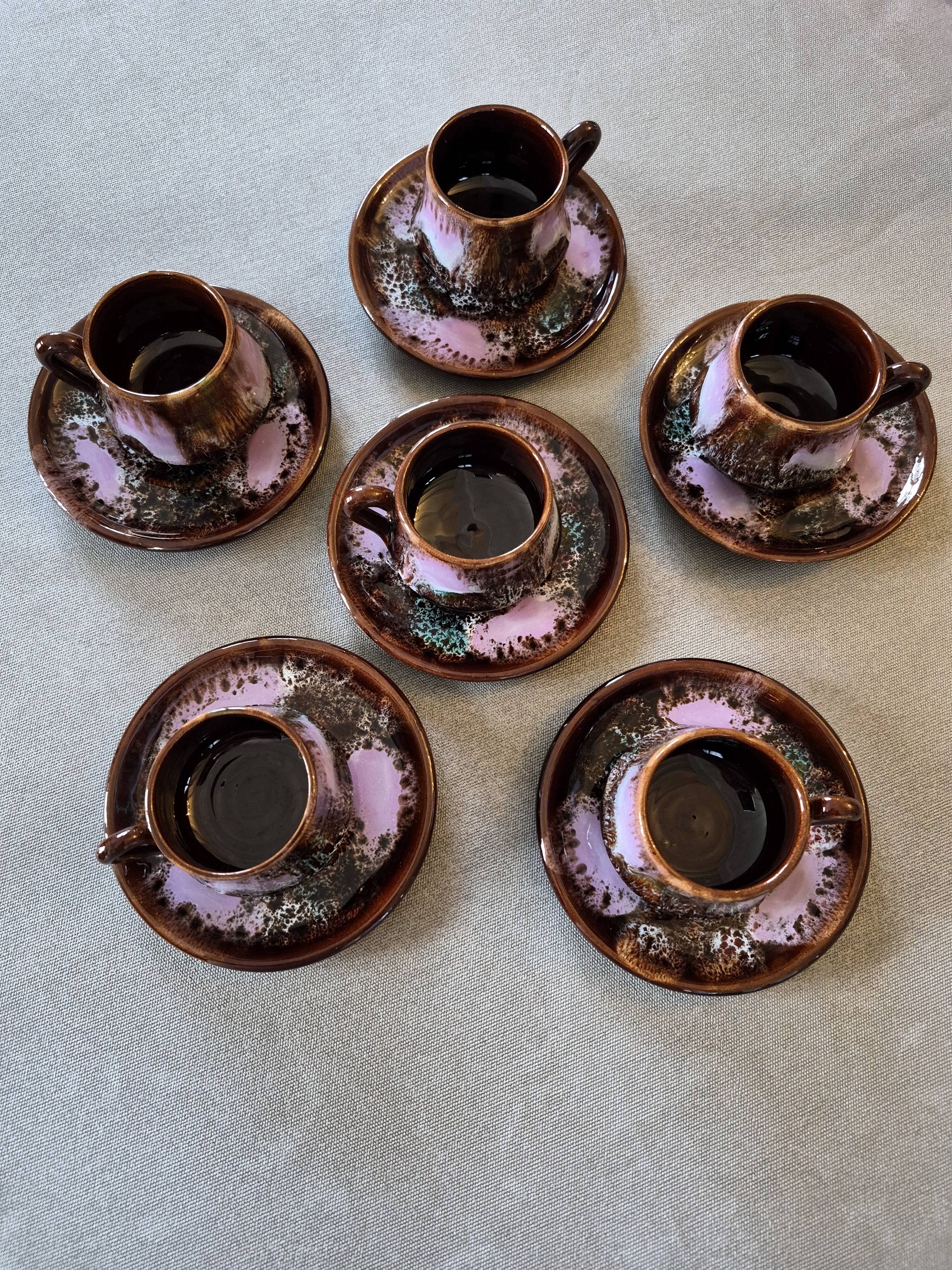 Six cups and saucers Vallauris glazed ceramic in brown and old pink.