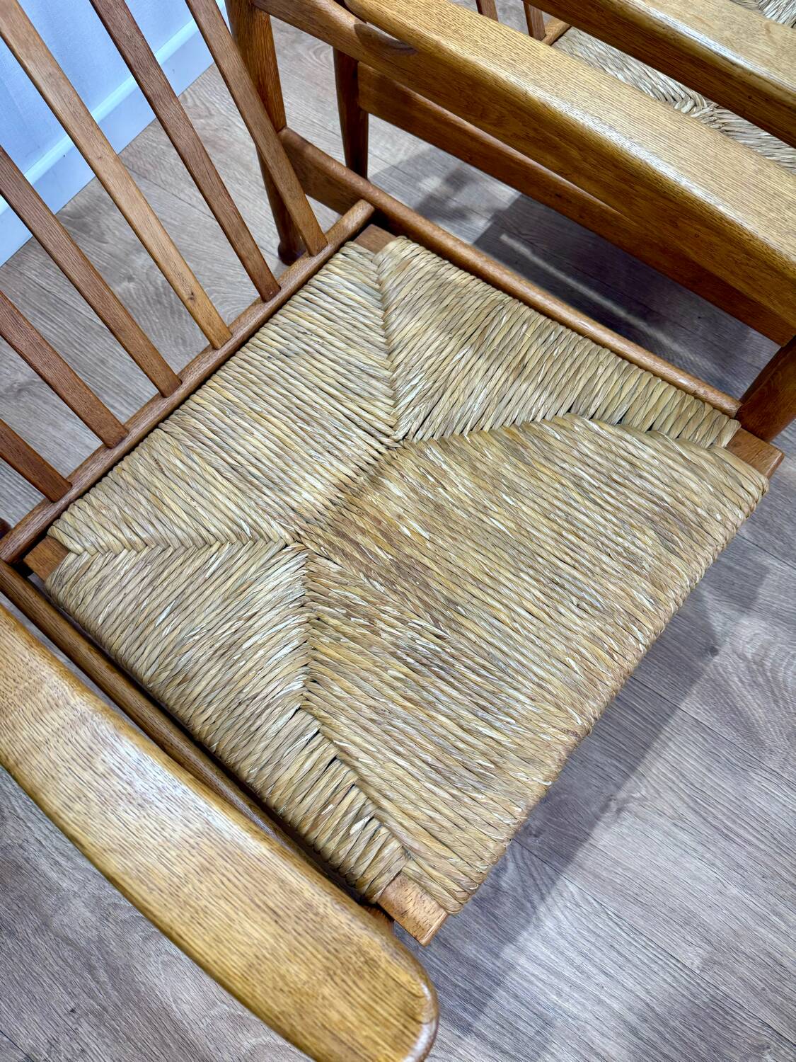 Pair of wooden and straw armchairs