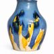 Baluster vase in Belgian ceramic with flowing blue and yellow glazes.