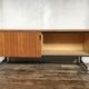 Sideboard in teak feet chrome sliding doors by Voko in 1960