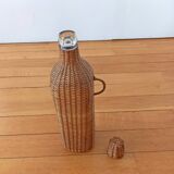 Bottle, old carafe in glass and wicker, 1950s