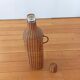 Bottle, old carafe in glass and wicker, 1950s