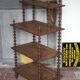 Napoleon III spool shelf, floor-standing shelf with brass tips.