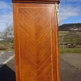 Louis XVI armoire with marquetry and gilded bronze