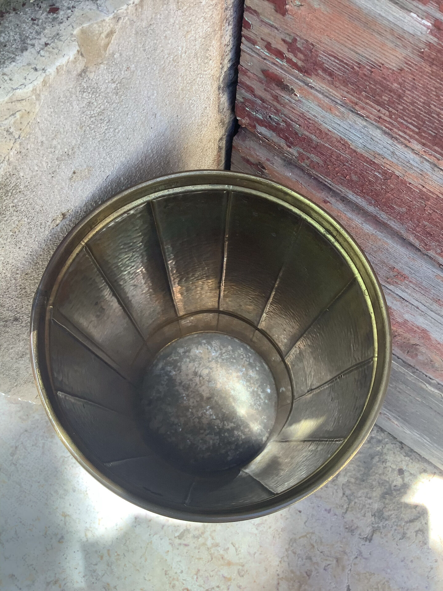 Vintage umbrella stand in patinated shell casing