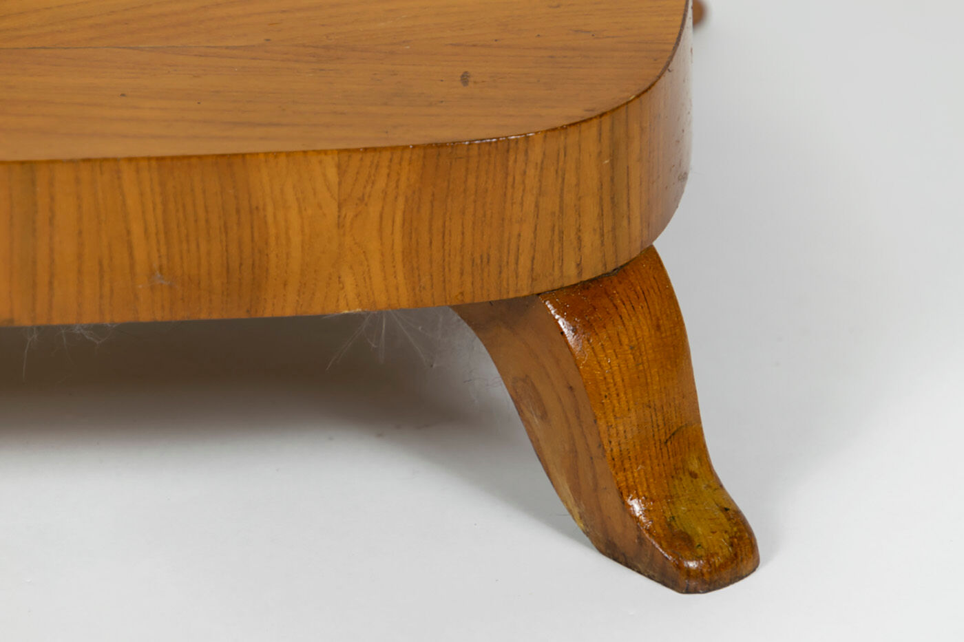 Danish Biedermeier elm occasional table with carved base and drawer