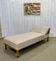 English daybed from the early 20th century in oak, some stains on the fabric