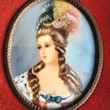 Pair of miniature portraits on ivory signed