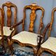 Set of two armchairs and six chairs. Marquetry with precious wood species.