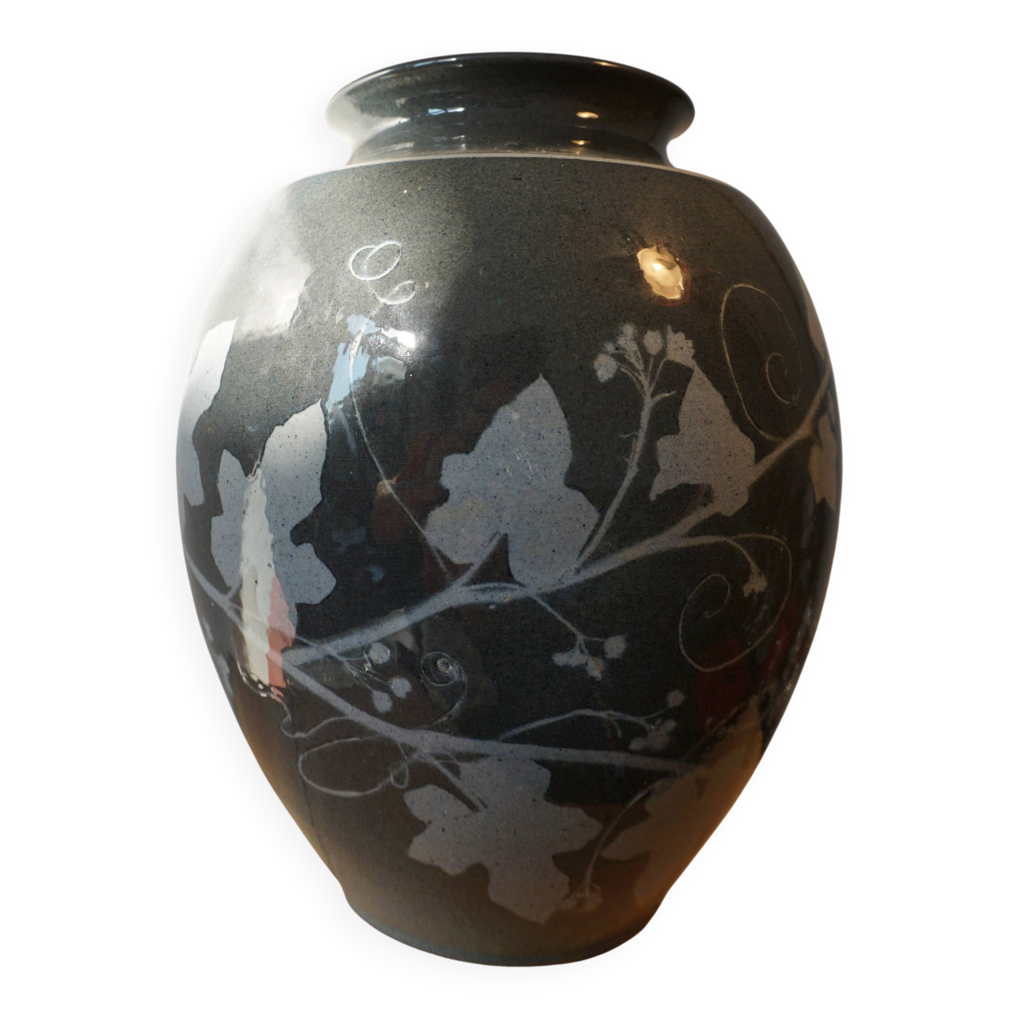 Black vase with plant decoration by Philippe Jacques