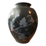 Black vase with plant decoration by Philippe Jacques