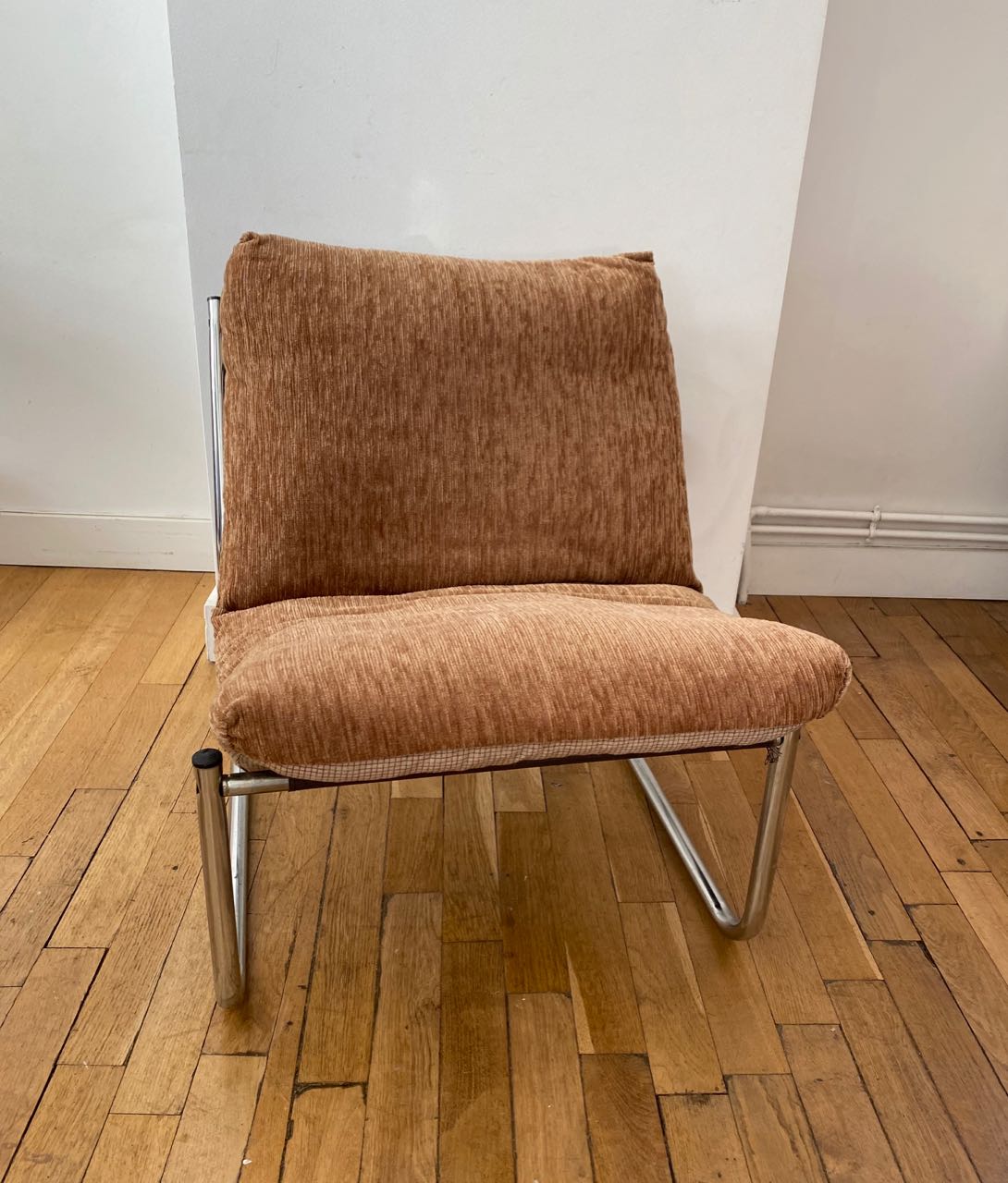 Beige and chrome armchair