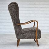 1960s, reupholstered Danish armchair, with stool, genuine sheepskin.