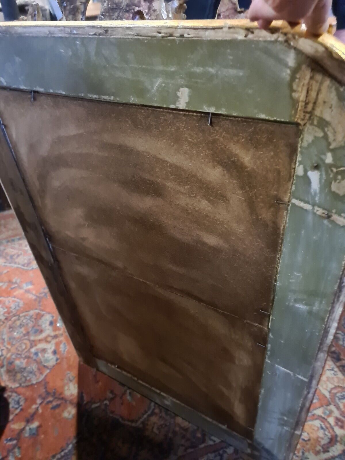 Golden mirror with a flute-playing angel