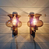 Pair of wall sconces in brass and smoked glass, 1960s.