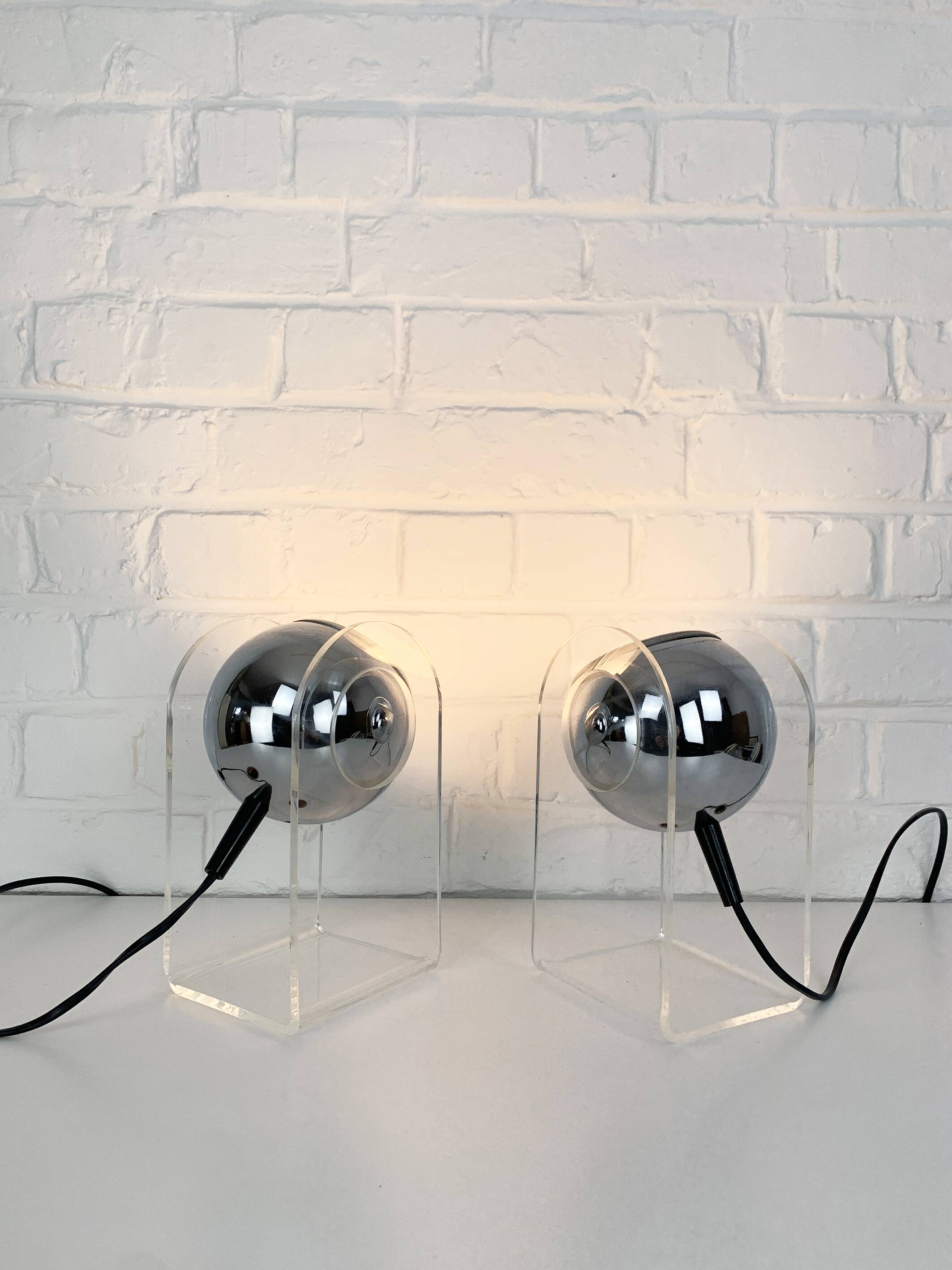 Pair of space age chrome plexiglass sphere table lamps from the 70s
