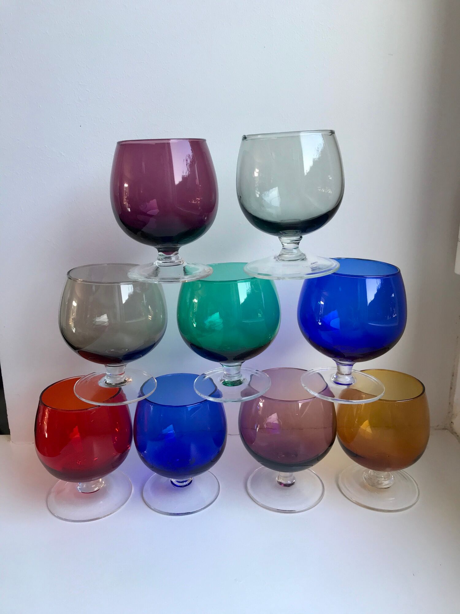 Set of 9 glasses with colored feet in blown glass 50s
