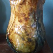 Vintage barbotine pitcher with floral decoration