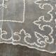 Old tablecloth embroidered with openwork embroidery.
