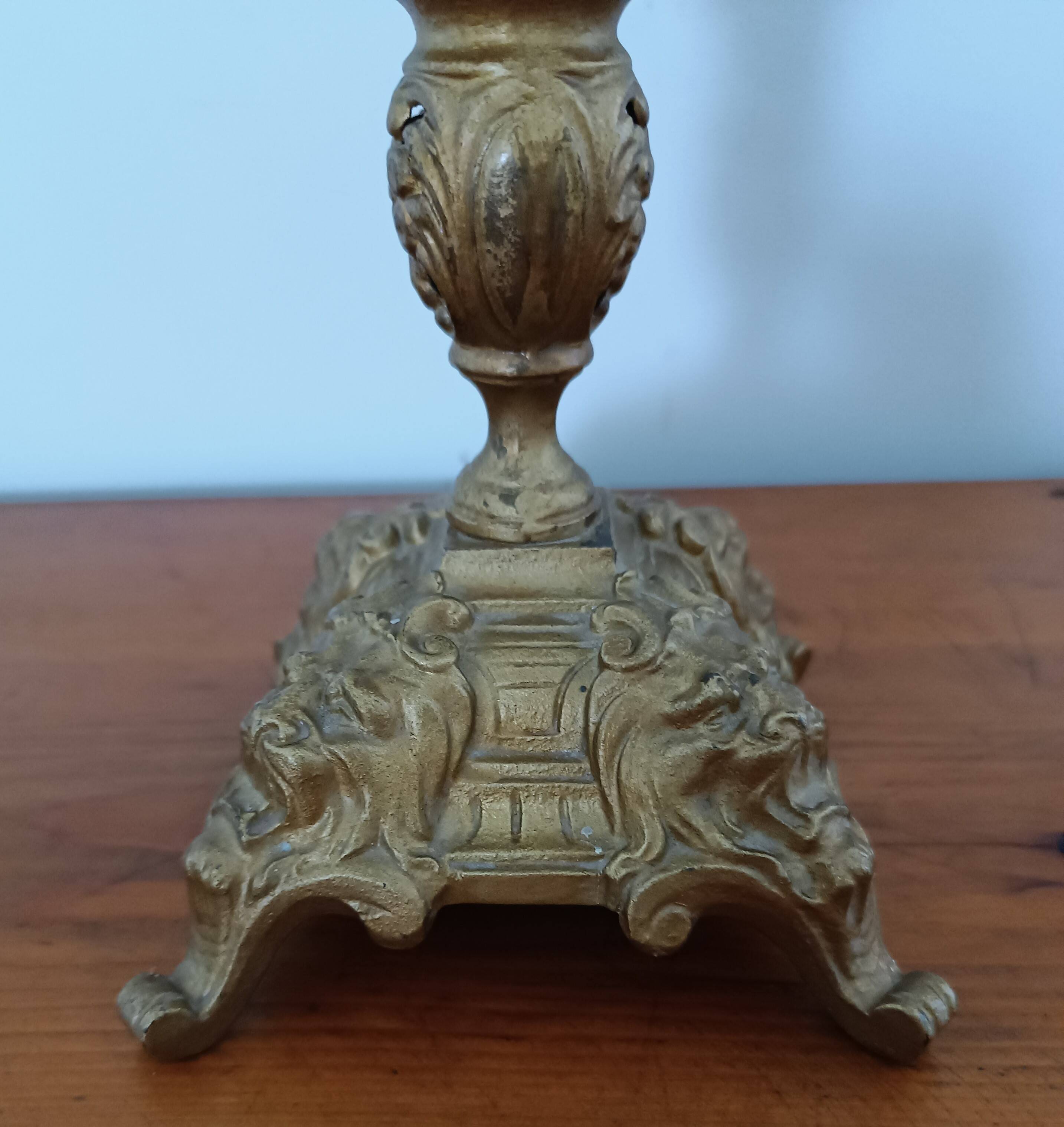 Bronze candlestick with lion head decoration