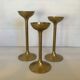 Trio of brass tulip foot candle holders
