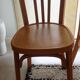Set of 4 light wood bistro chairs stamped Baumann and Thonet.